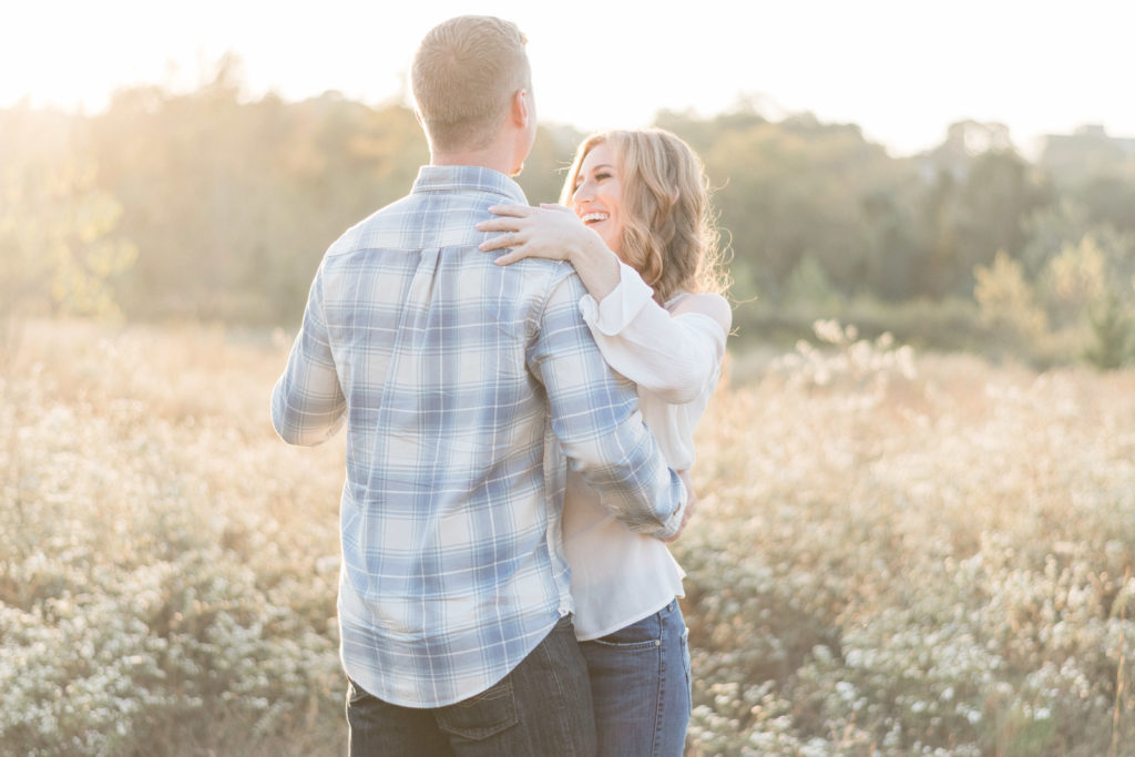 charlotte engagement photography shot of couple dancing in field