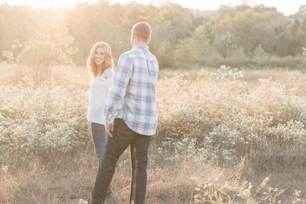 charlotte engagement photography shot of couple bride to be walking with groom to be