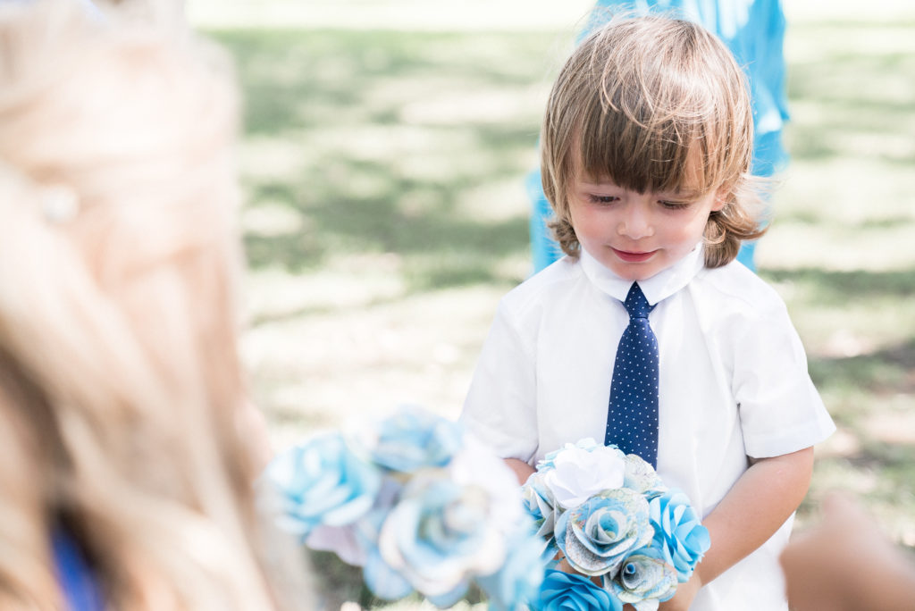 charleston wedding photographer shot of young kid with flowers