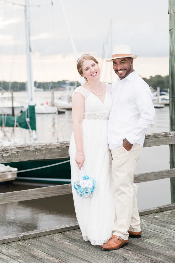 charleston wedding photographer shot of bride and groom of boat dock