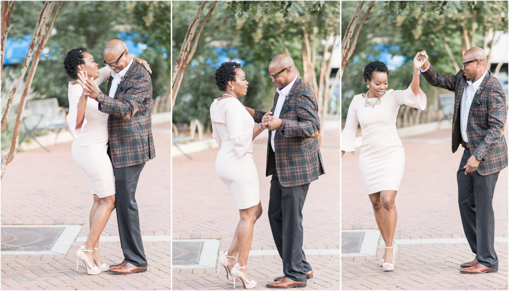 engagement photographer in charlotte capturing couple in romare bearden park dancing together in uptown
