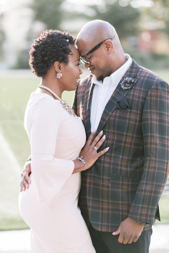 engagement photographer in charlotte capturing couple in romare bearden park forehead to forehead