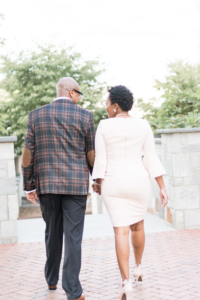 engagement photographer in charlotte capturing couple in romare bearden park in uptown