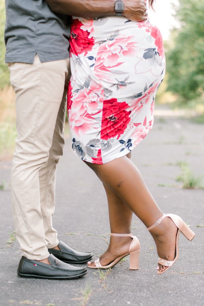 Charlotte NC Engagement Photographer couple on abadoned road south charlotte uptown