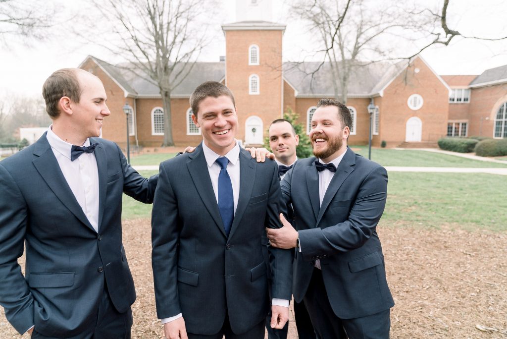 Wedding Photographer in Charlotte NC South Park Forrest Hill Church groomsmen hanging out with groom before first look