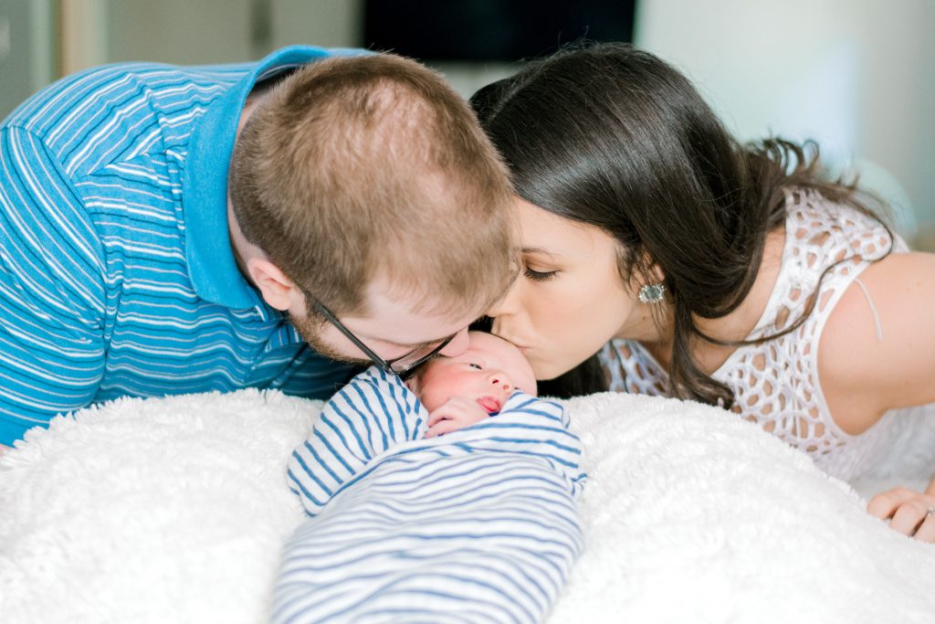 charlotte nc newborn photography baby mother father kiss on forehead