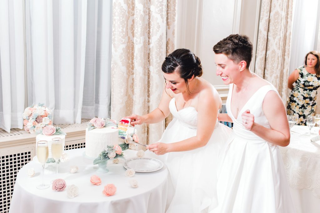 hotel concord wedding cake cutting pride rainbow same sex couple