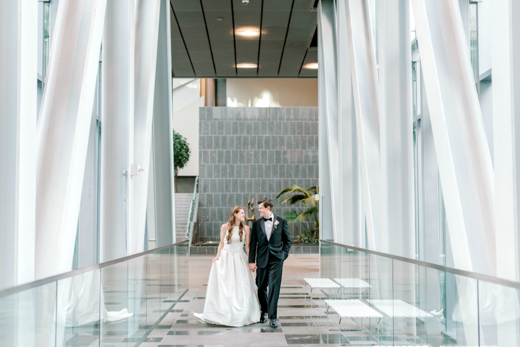 Bride and groom walking in Ritz Carlton Charlotte