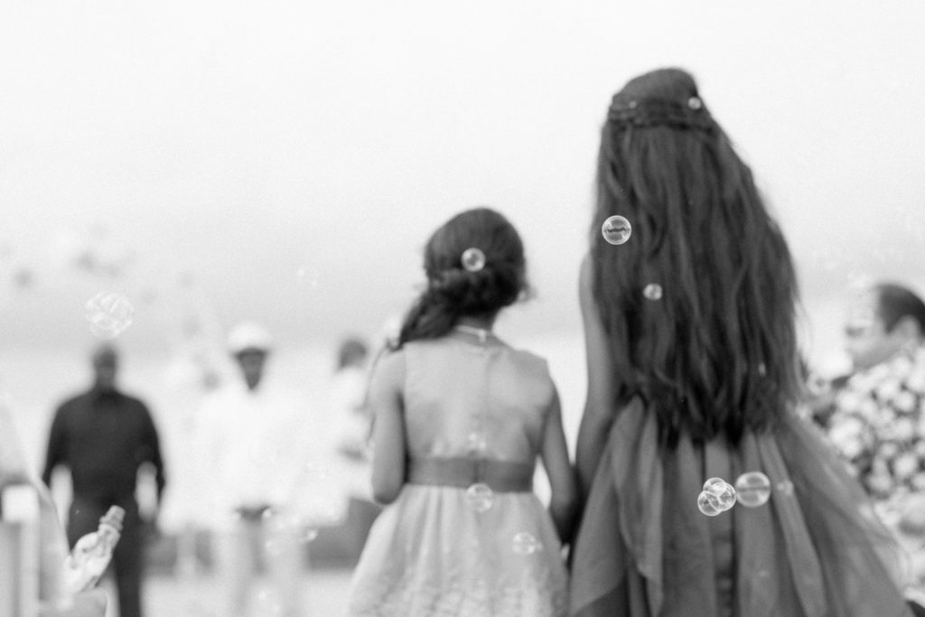 charleston wedding photographer shot of flower girls blowing bubbles