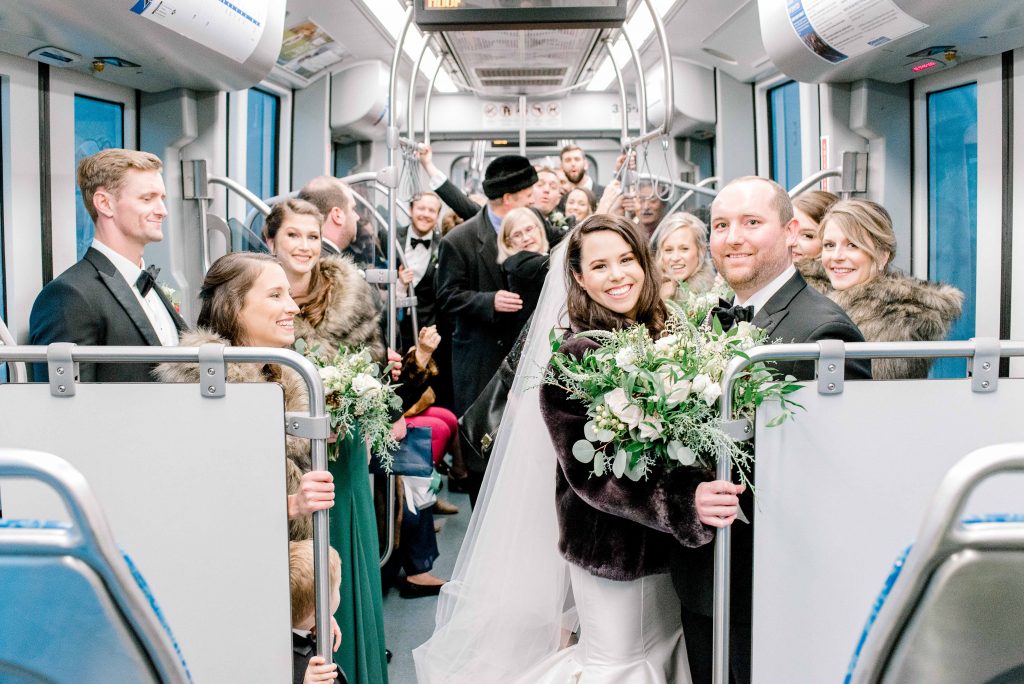 lightrail train ride charlotte north carolina bride and groom