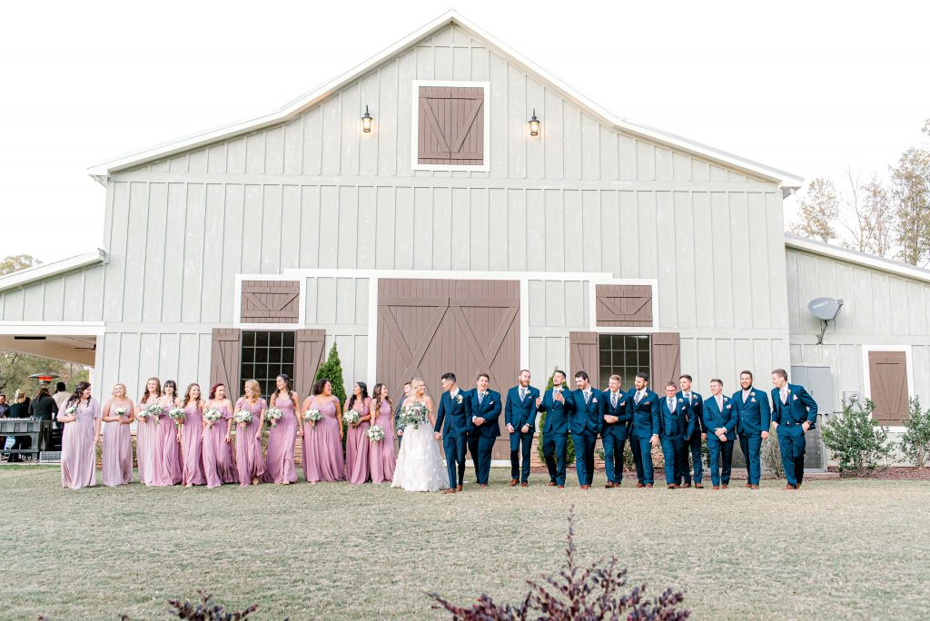 bride and groom portraits with wedding party