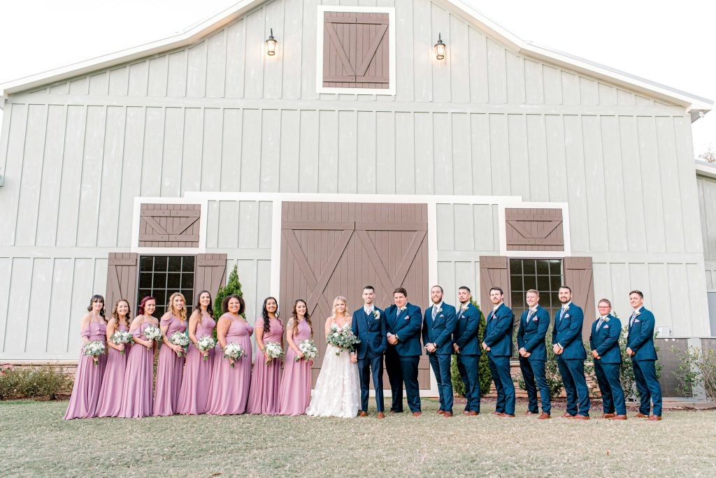 bride and groom portraits with wedding party