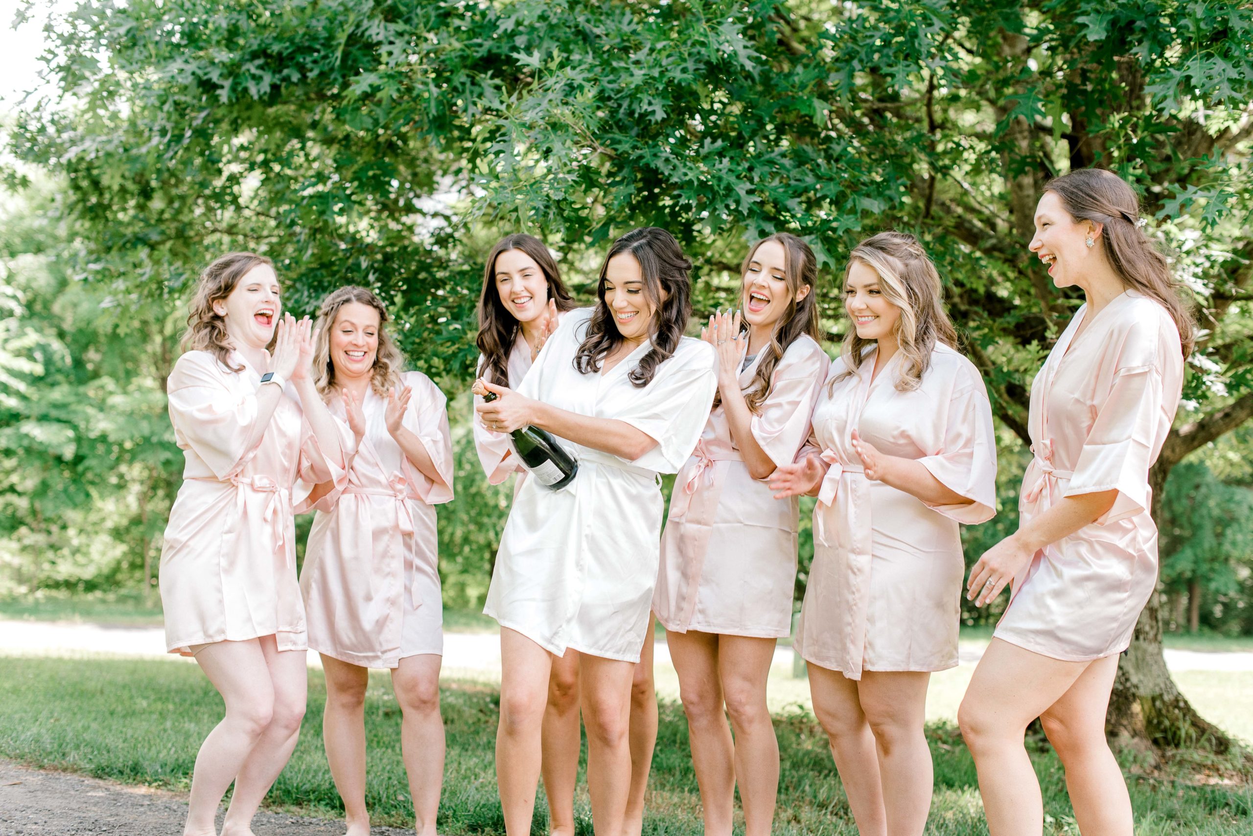 champagne toast with bridesmaids 