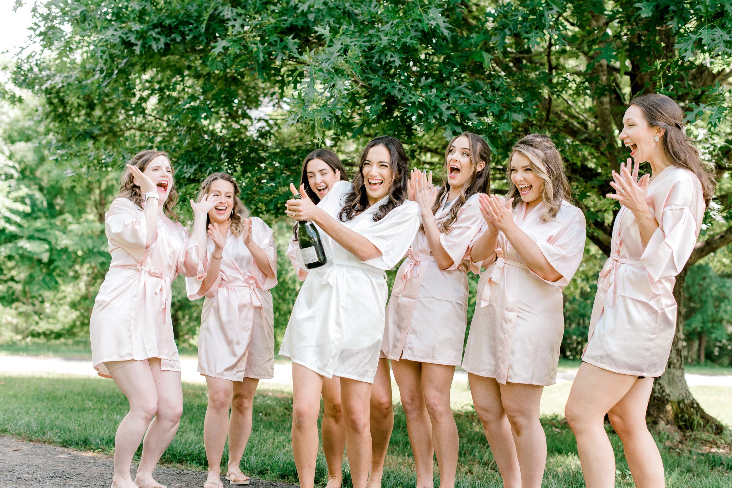 champagne toast with bridesmaids