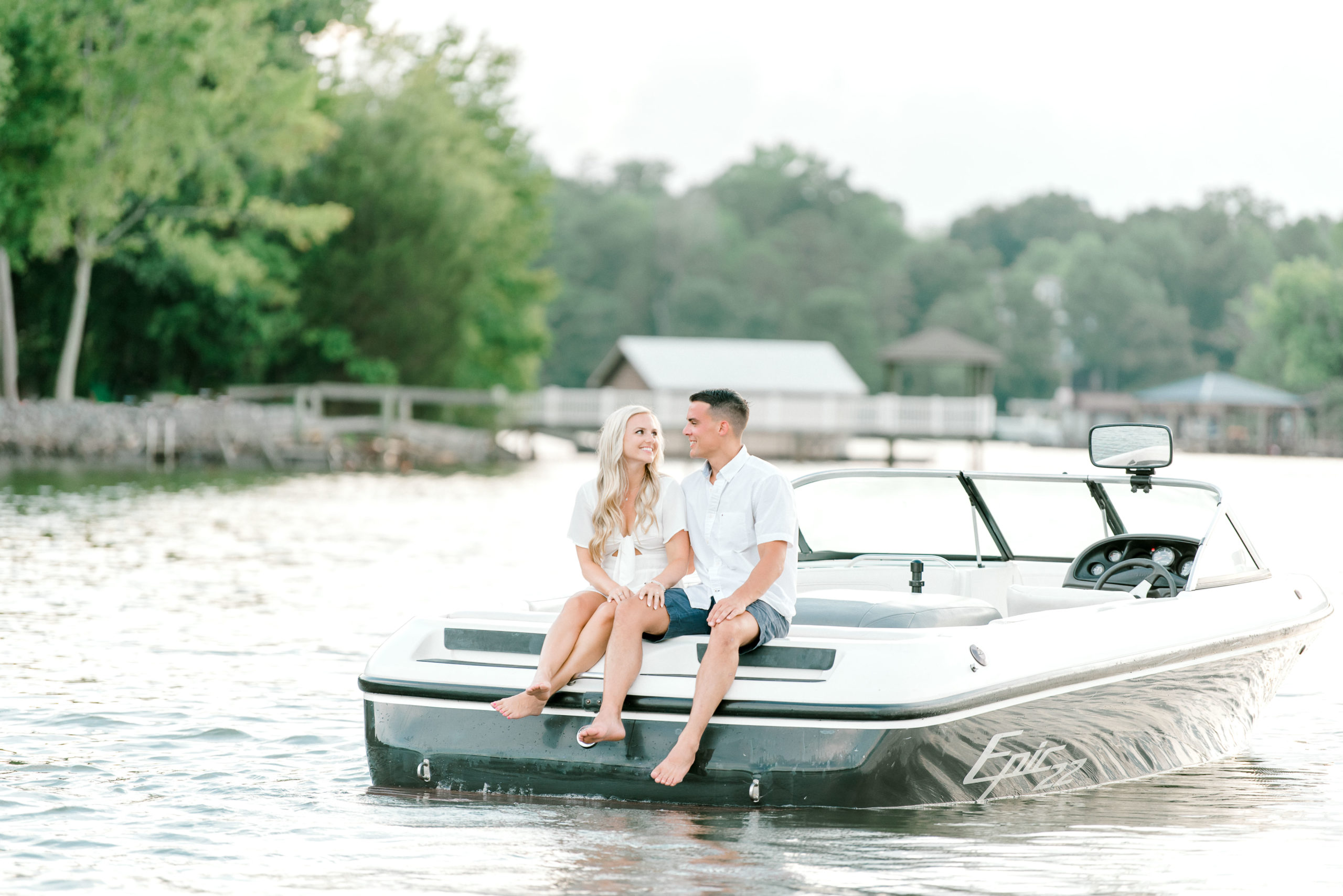 couple sitting on the back of boat