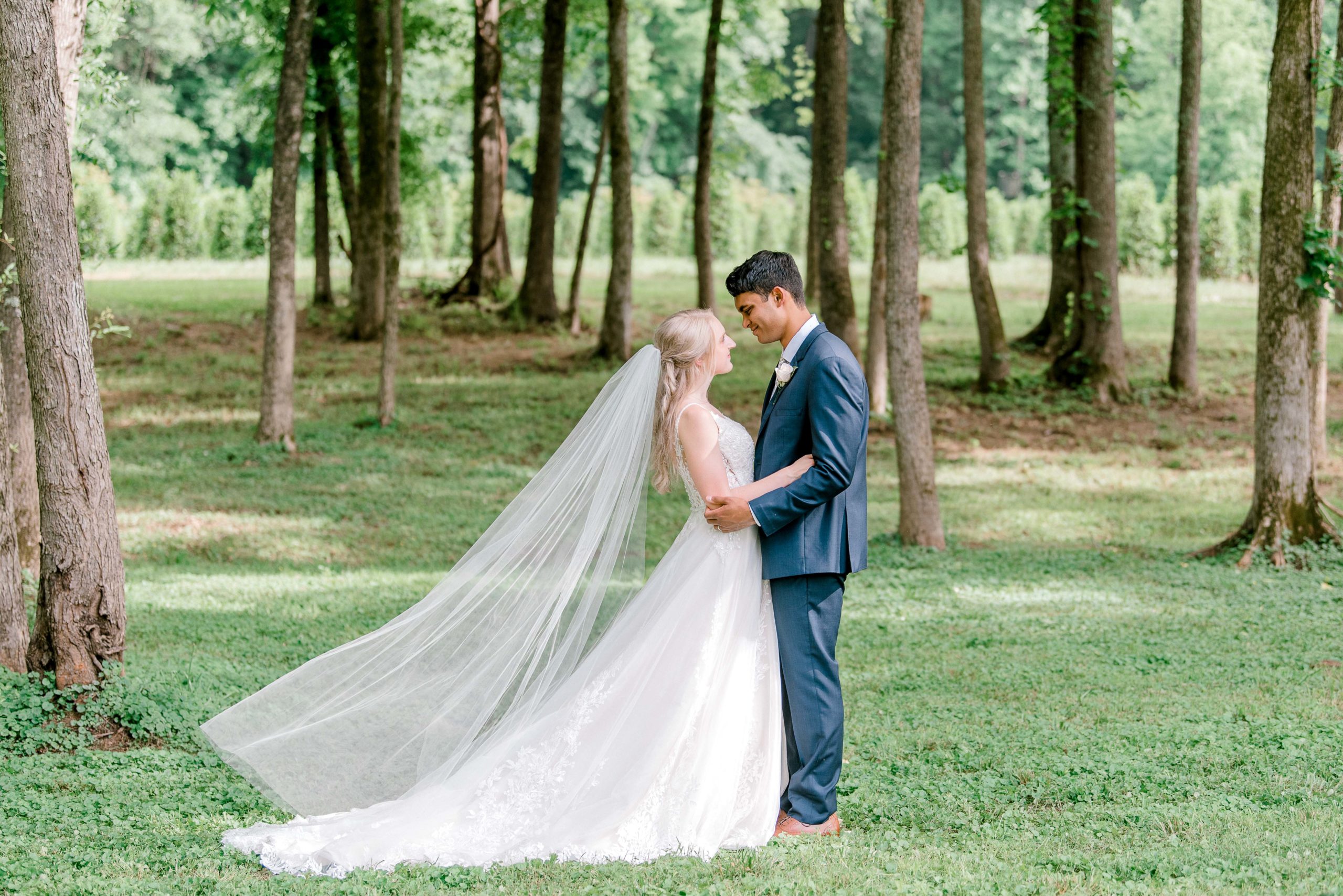bride and groom flowing veil