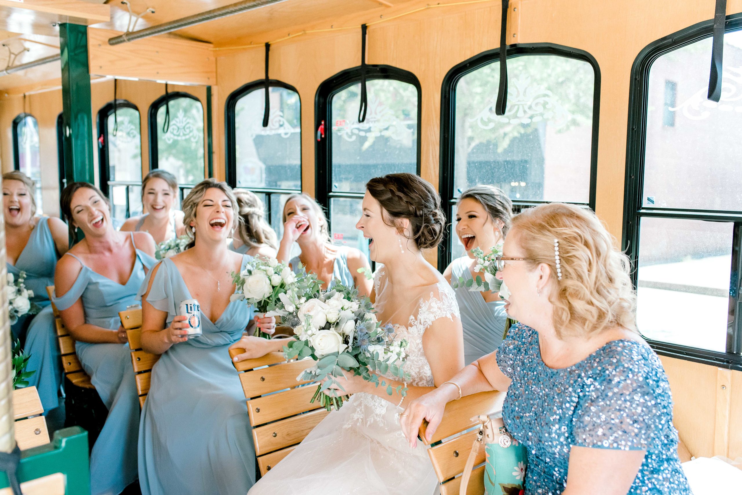 bride and wedding party on trolley
