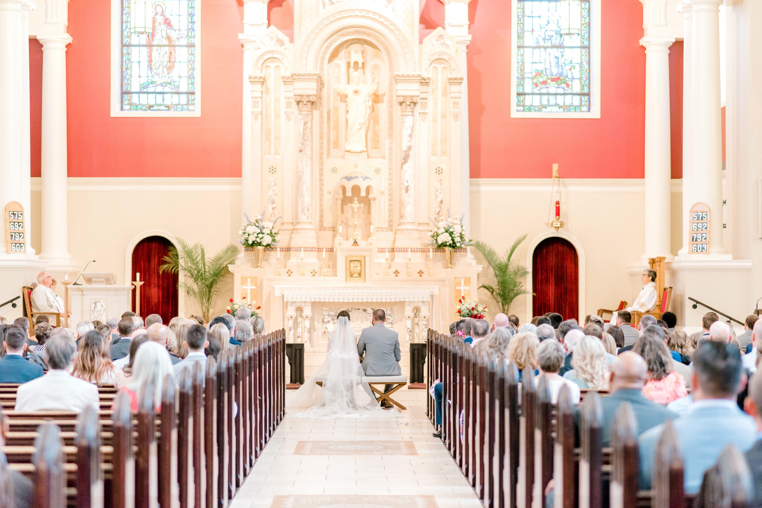 bride and groom sitting in church